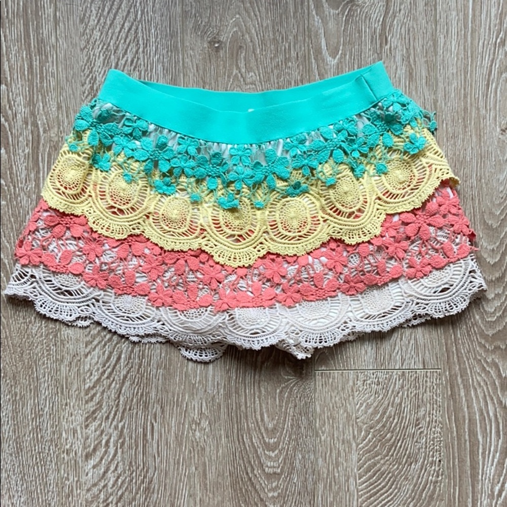 Multi-color Umgee USA shorts, size small.